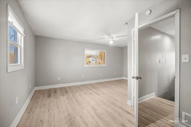 a view of an empty room and window