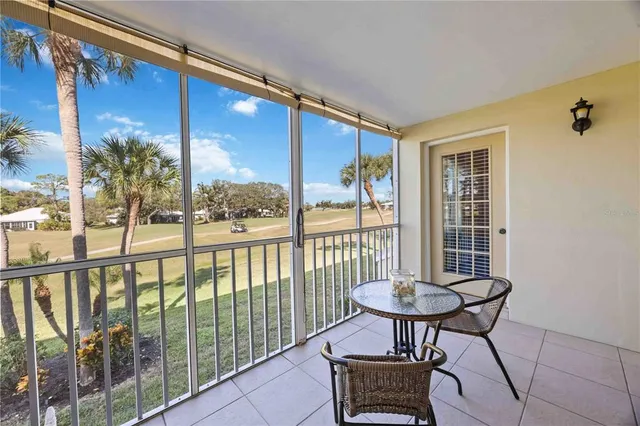 an aerial view of a house with a garden and deck