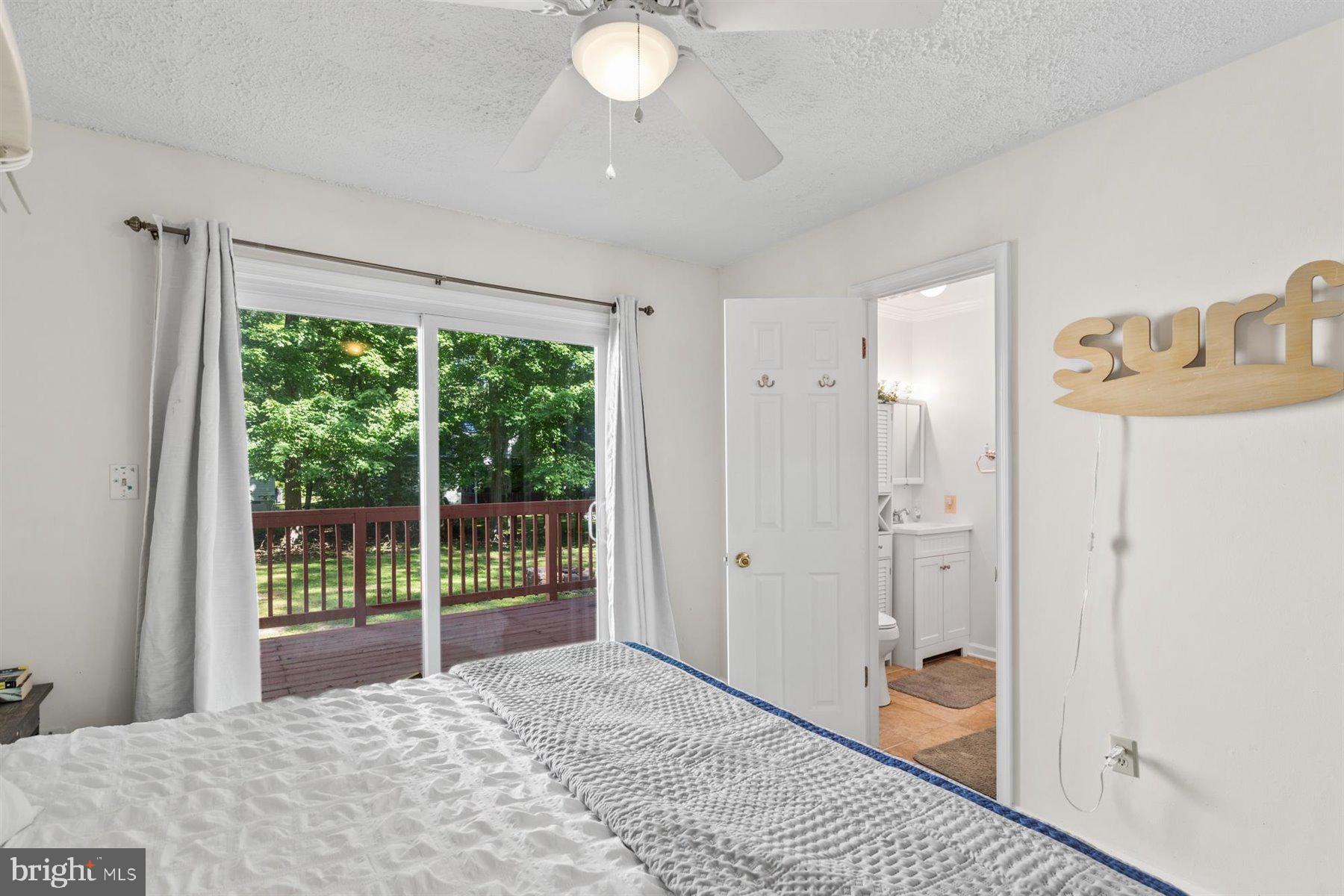 90 Windjammer Road Berlin, MD 21811 - Photo 14 of 32 Primary Bedroom w/ Slider to the Deck