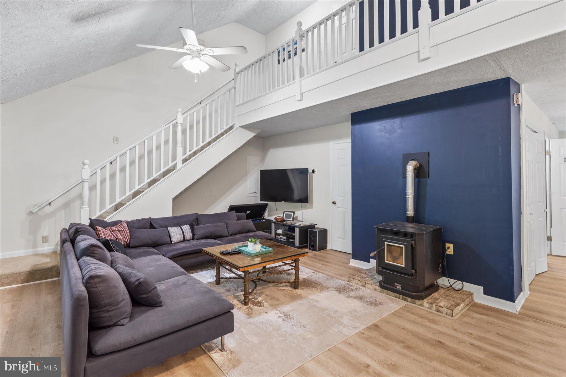 90 Windjammer Road Berlin, MD 21811 - Photo 2 of 32 Living Room w/ Fireplace and High Ceilings
