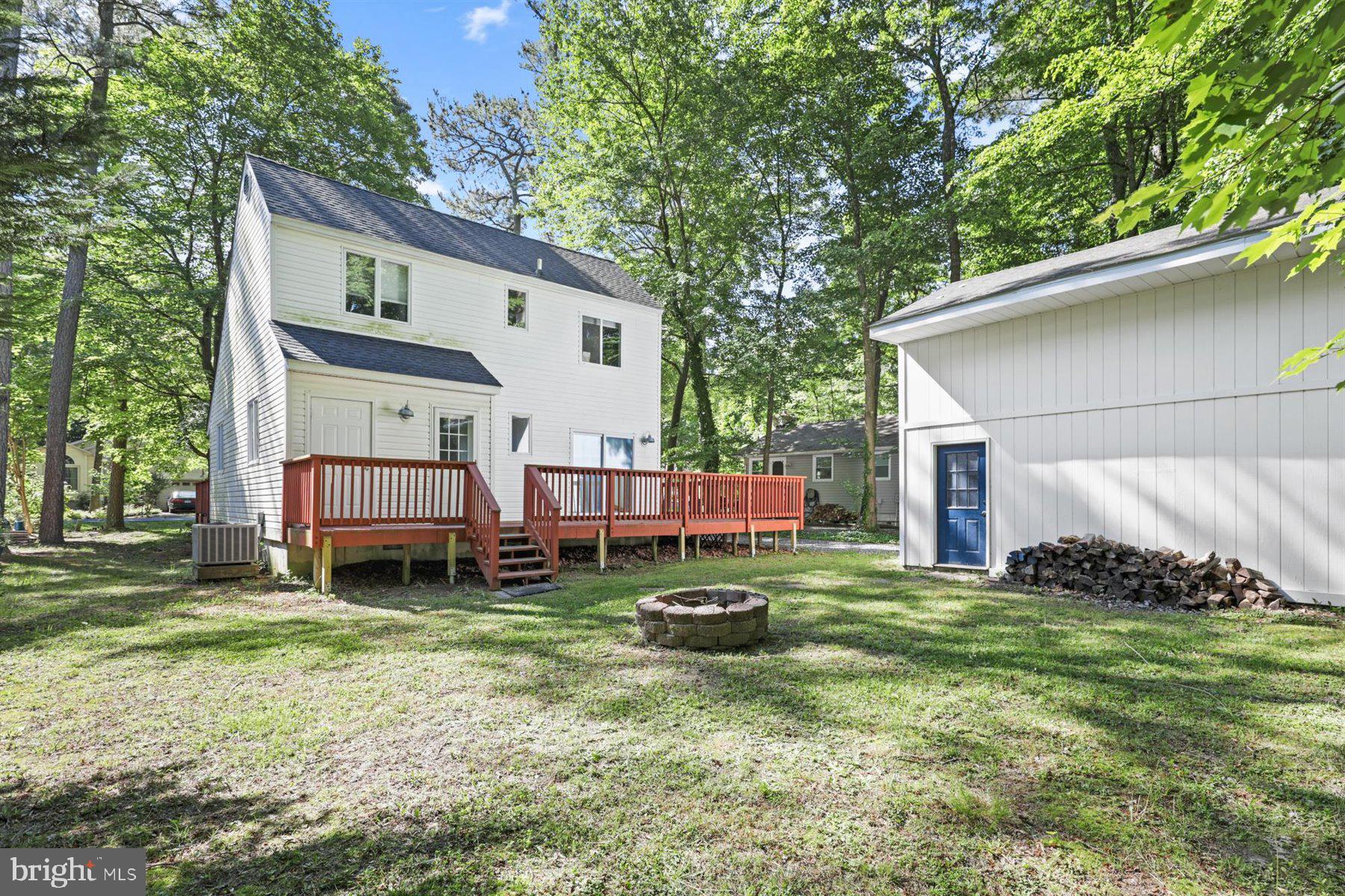 90 Windjammer Road Berlin, MD 21811 - Photo 29 of 32 Back yard view of the house and garage w/ storage