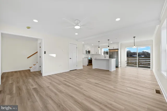 a view of a kitchen with wooden floor
