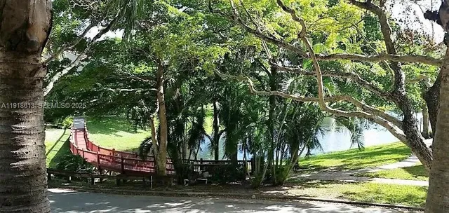 a view of a tree in front of a house