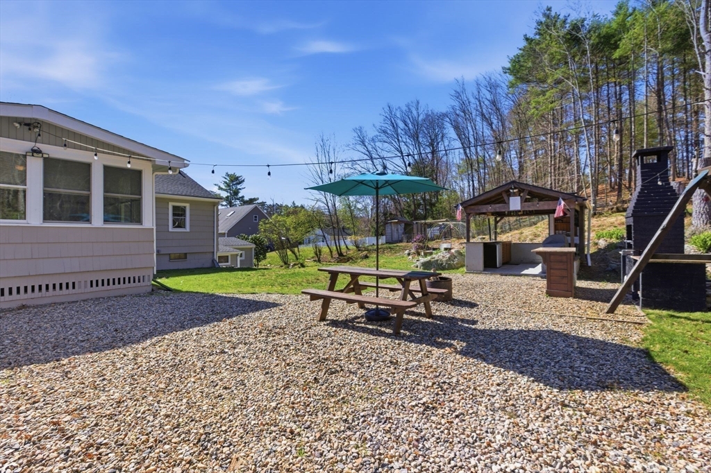 38 Woodland Road Georgetown, MA 01833 - Photo 39 of 42 a view of a house with backyard porch and sitting area
