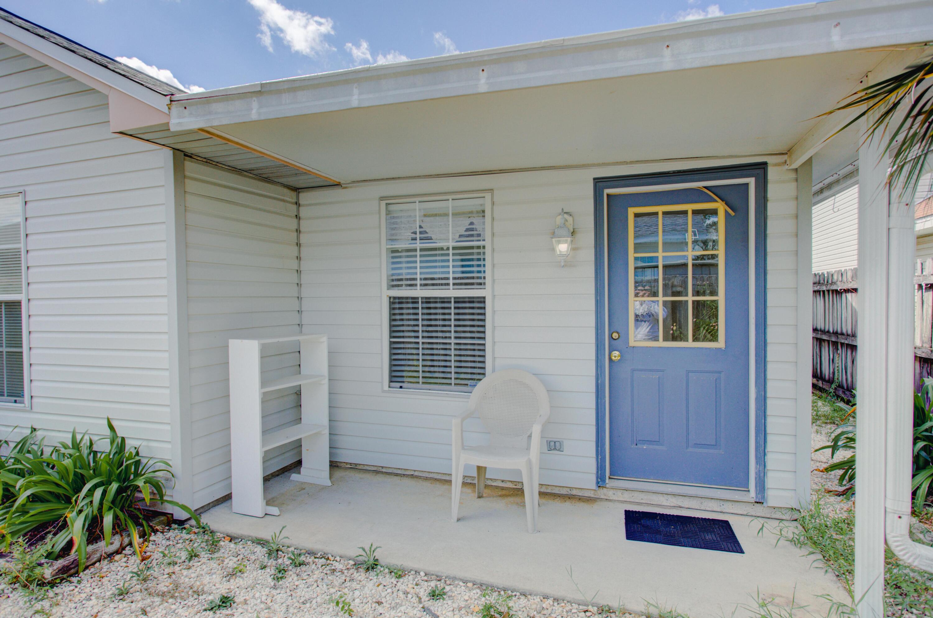38 Ruby Circle Mary Esther, FL 32569 - Photo 16 of 16 a view of a house with a chairs in patio