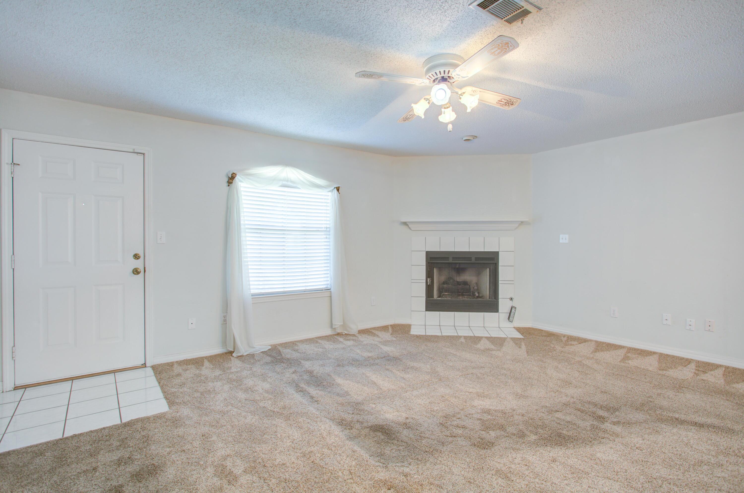 38 Ruby Circle Mary Esther, FL 32569 - Photo 5 of 16 a view of an empty room with a chandelier fan