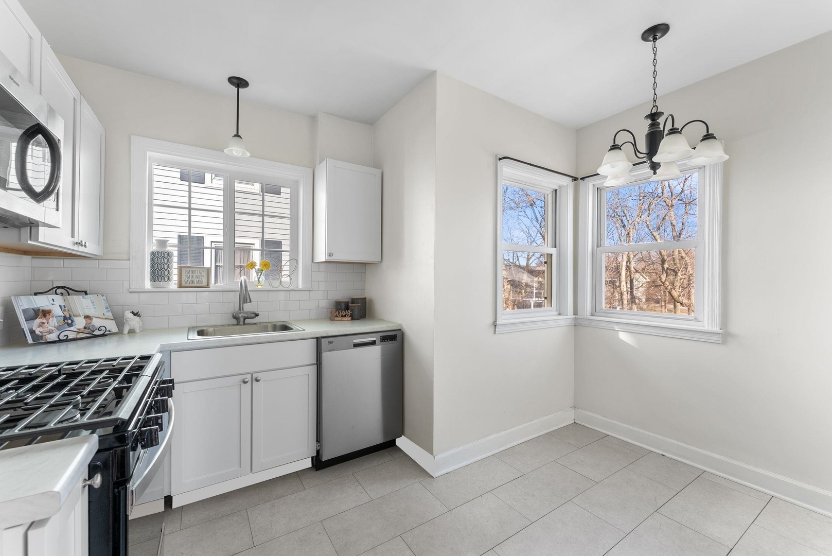 2341 33rd Street Moline, IL 61265 - Photo 6 of 12 a kitchen that has a lot of cabinets in it and a window