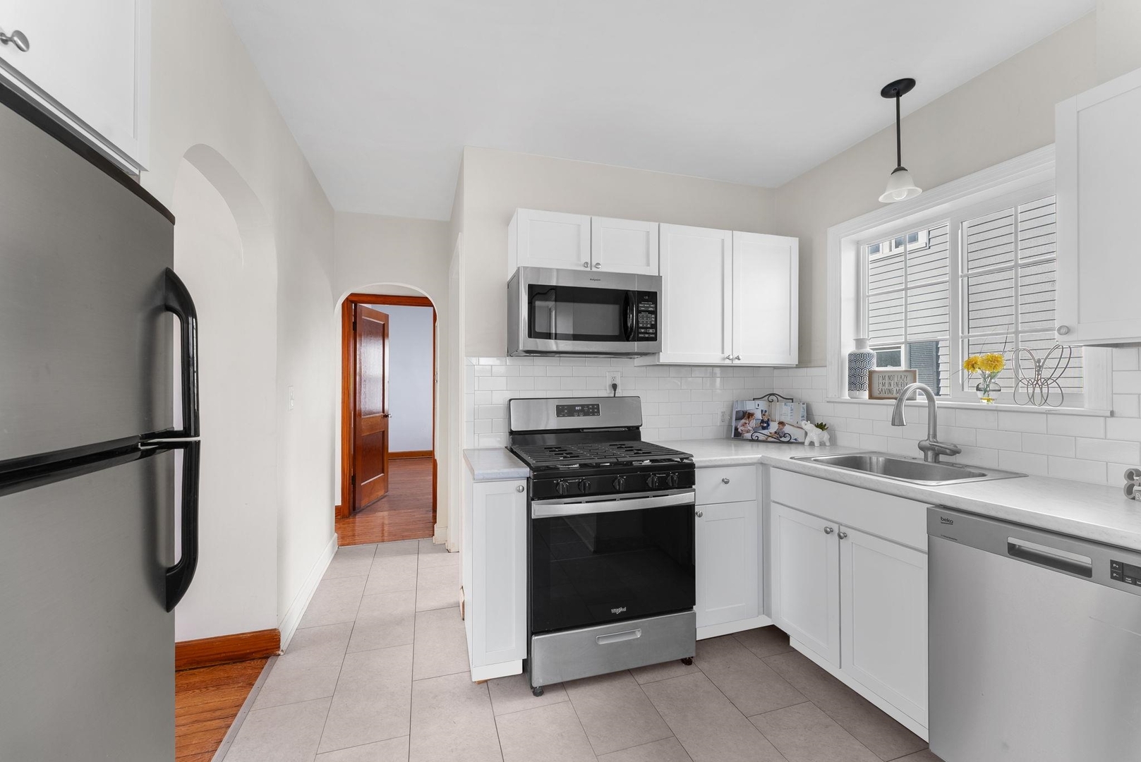 2341 33rd Street Moline, IL 61265 - Photo 7 of 12 a kitchen with stainless steel appliances granite countertop a stove a sink and a refrigerator