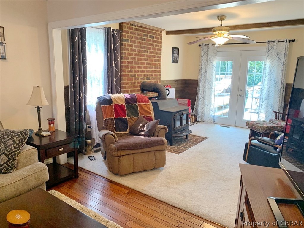 624 Butylo Road Laneview, VA 22504 - Photo 8 of 21 Living room opens to den with cozy wood stove!