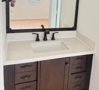 a bathroom with a sink and a mirror