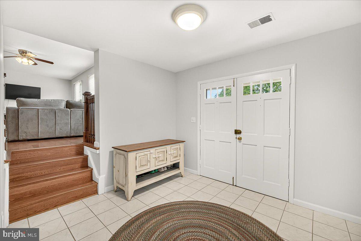 19808 Westerly Avenue Poolesville, MD 20837 - Photo 12 of 64 a view of a livingroom with furniture and stairs