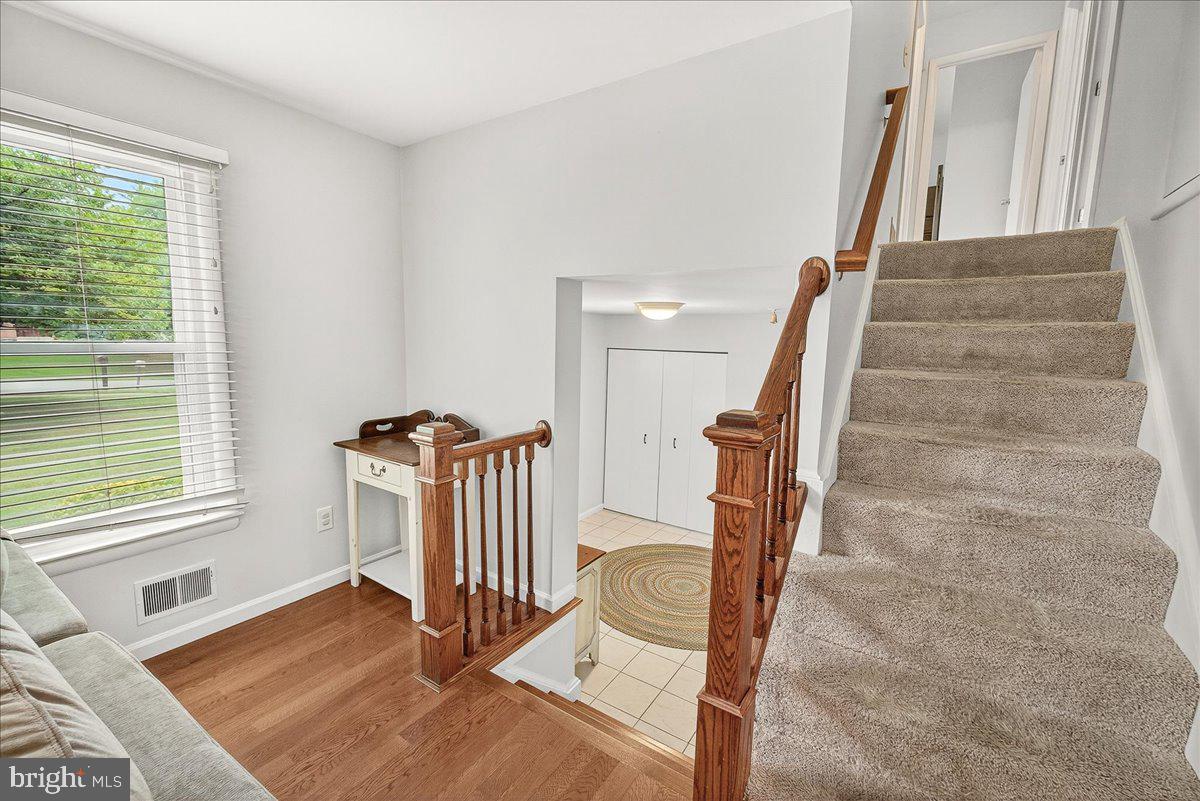 19808 Westerly Avenue Poolesville, MD 20837 - Photo 15 of 64 a view of entryway with wooden floor and stairs