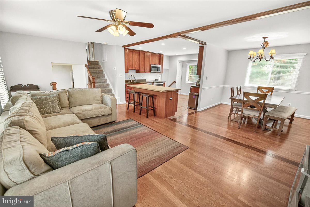 19808 Westerly Avenue Poolesville, MD 20837 - Photo 64 of 64 a living room with furniture and a dining table with kitchen view