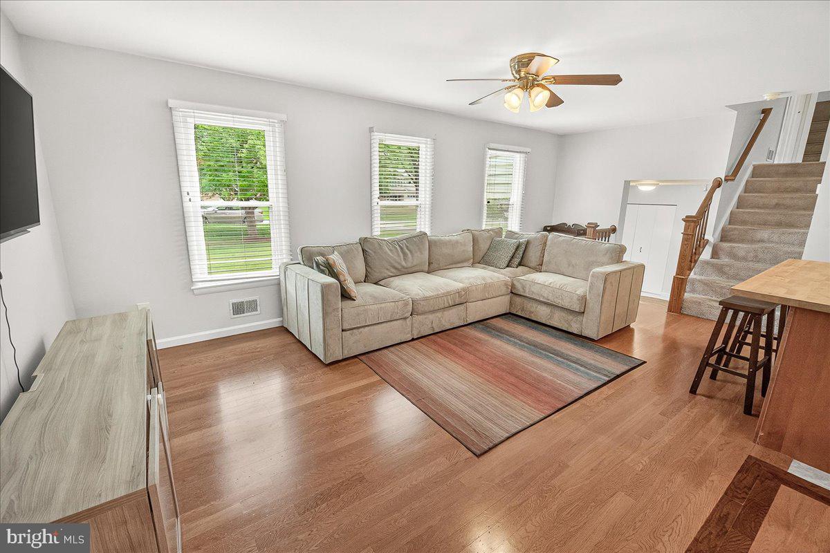 19808 Westerly Avenue Poolesville, MD 20837 - Photo 28 of 64 a living room with furniture and a large window