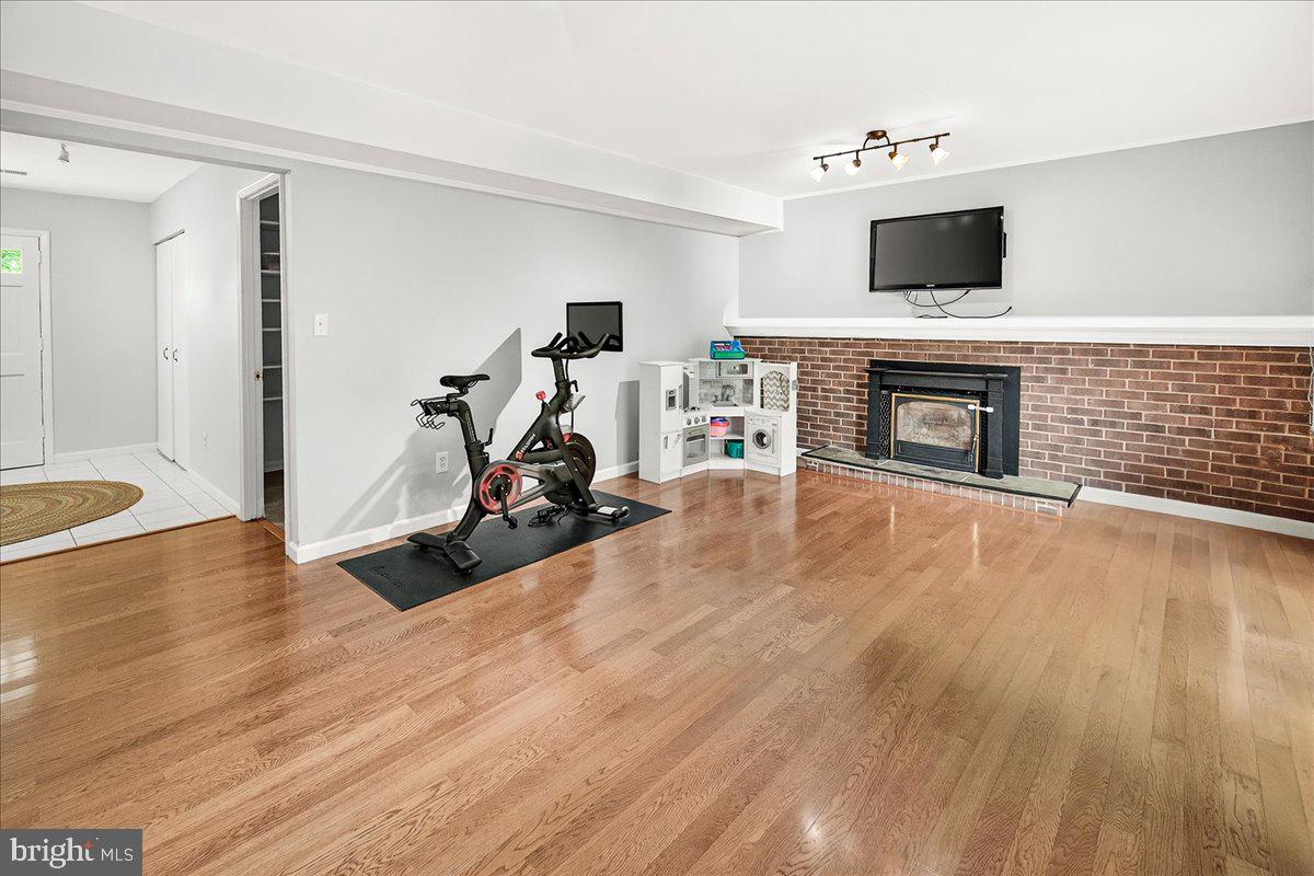 19808 Westerly Avenue Poolesville, MD 20837 - Photo 30 of 64 a view of a livingroom with a fireplace and a window