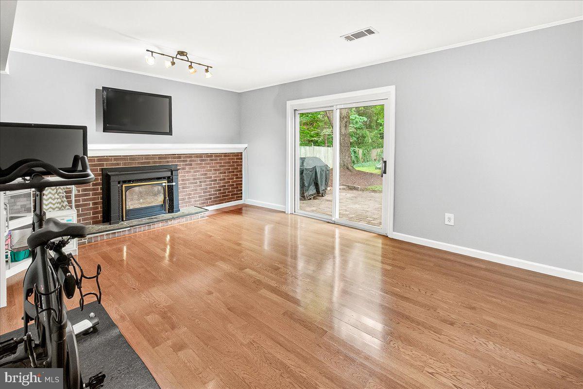 19808 Westerly Avenue Poolesville, MD 20837 - Photo 31 of 64 a view of livingroom with furniture fireplace and window