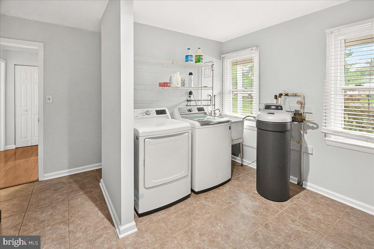 19808 Westerly Avenue Poolesville, MD 20837 - Photo 34 of 64 a view of a kitchen with refrigerator and window