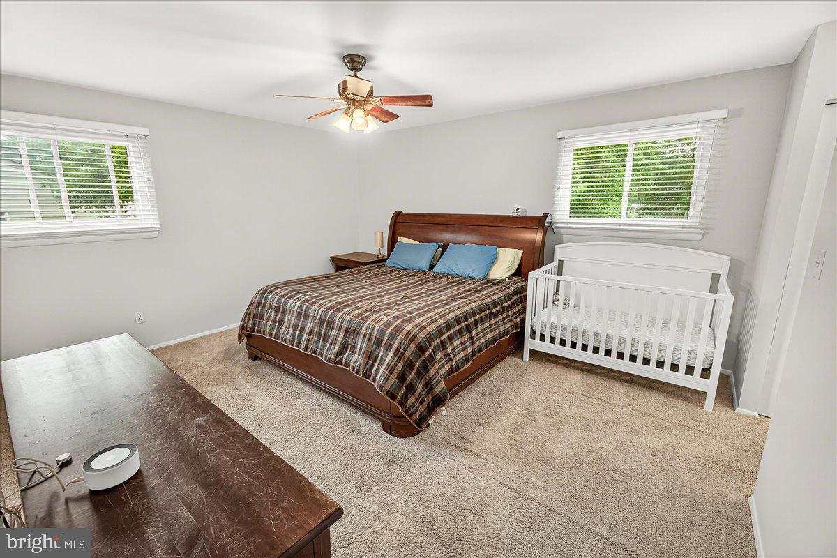 19808 Westerly Avenue Poolesville, MD 20837 - Photo 36 of 64 a bedroom with a bed and a window