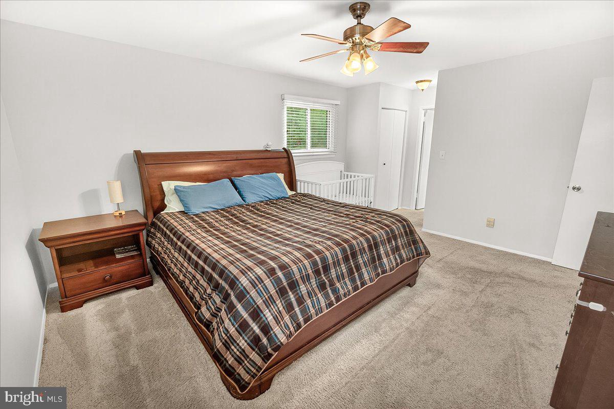 19808 Westerly Avenue Poolesville, MD 20837 - Photo 37 of 64 a bedroom with a bed and window