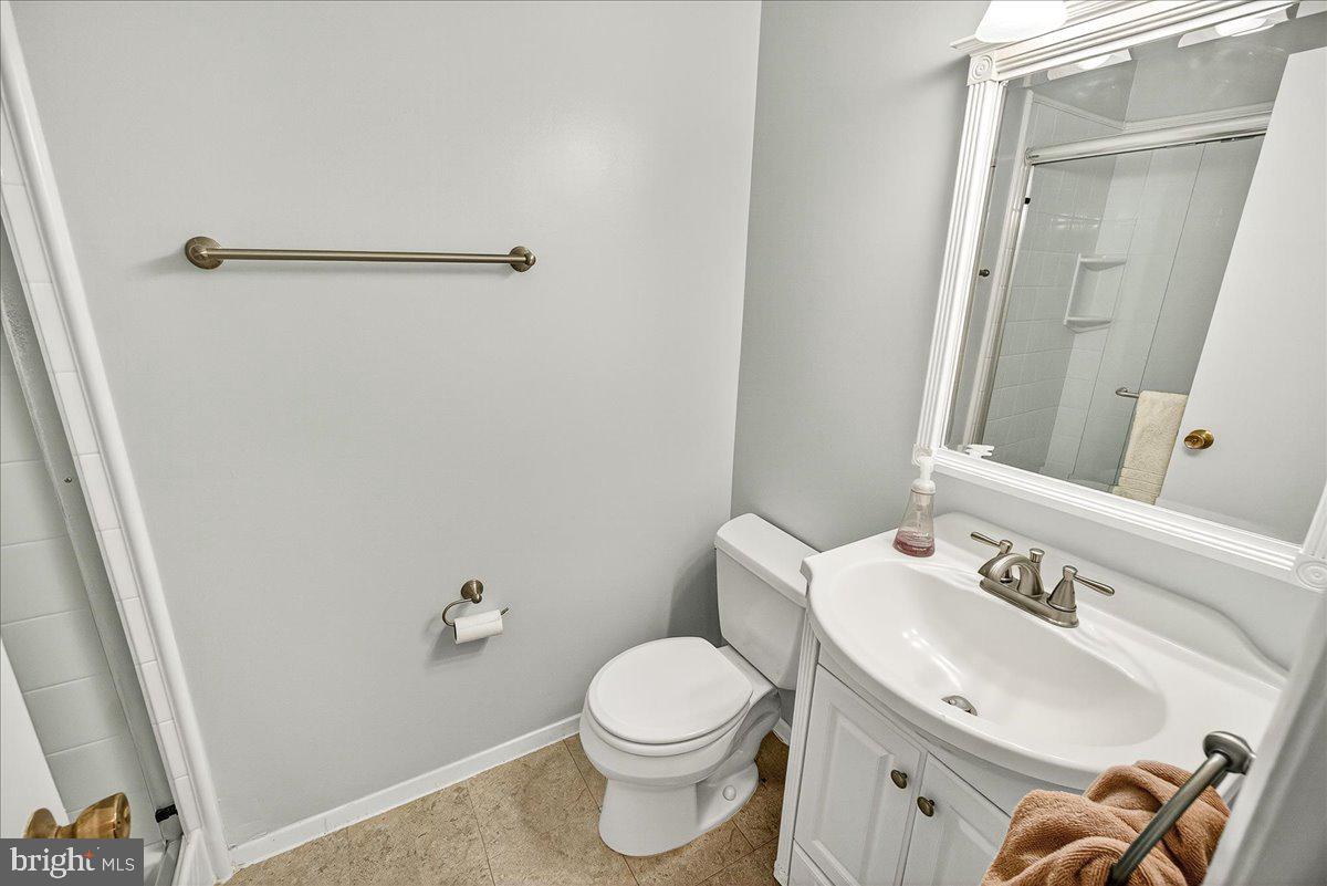 19808 Westerly Avenue Poolesville, MD 20837 - Photo 39 of 64 a bathroom with a sink a toilet and shower