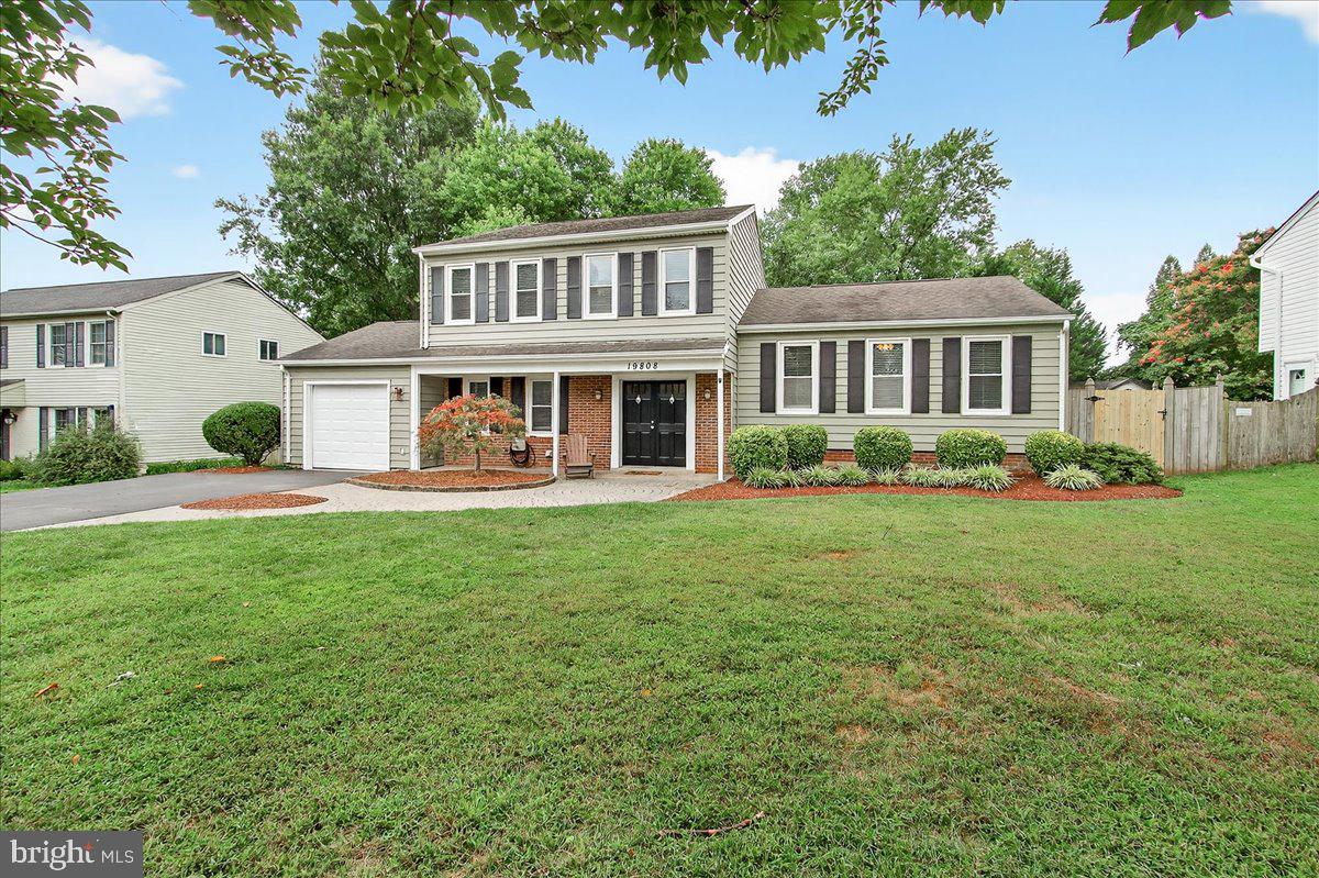 19808 Westerly Avenue Poolesville, MD 20837 - Photo 4 of 64 a front view of a house with a yard and potted plants