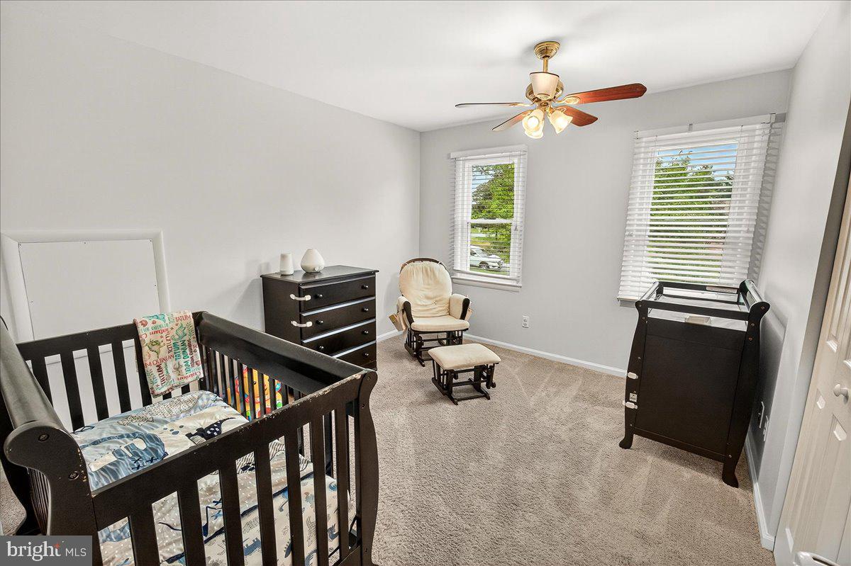 19808 Westerly Avenue Poolesville, MD 20837 - Photo 41 of 64 a bedroom with furniture and a window