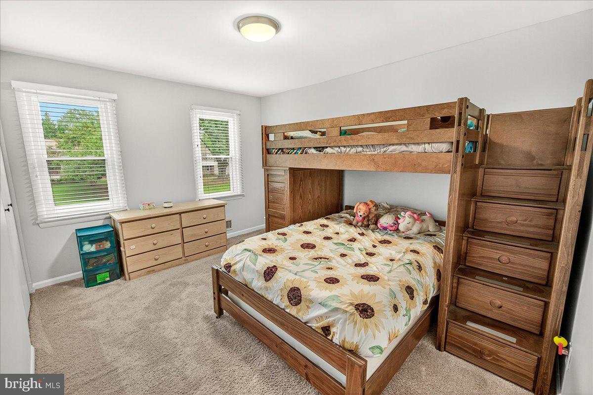 19808 Westerly Avenue Poolesville, MD 20837 - Photo 42 of 64 a bedroom with a bed and a window