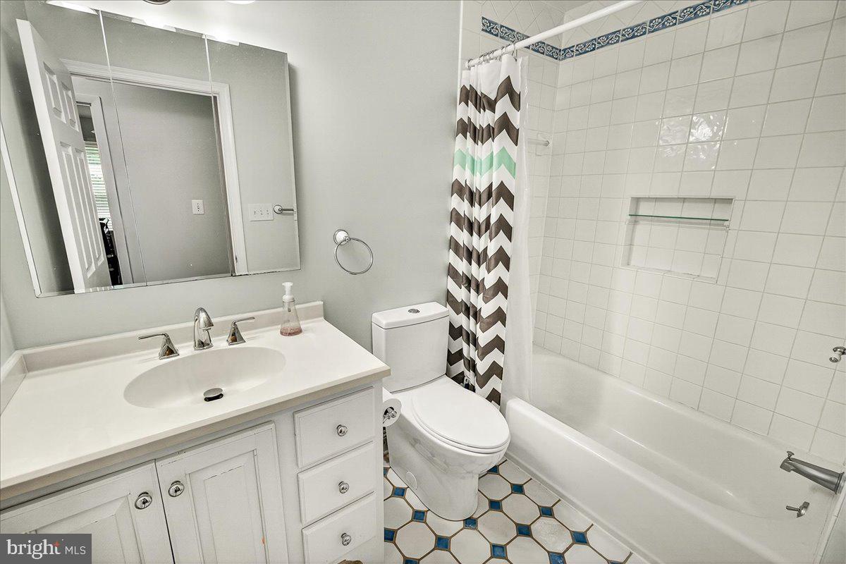 19808 Westerly Avenue Poolesville, MD 20837 - Photo 43 of 64 a bathroom with a sink a toilet and shower