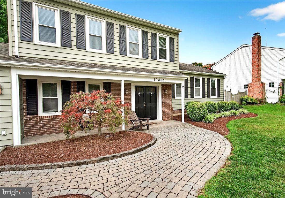 19808 Westerly Avenue Poolesville, MD 20837 - Photo 5 of 64 a front view of a house with garden