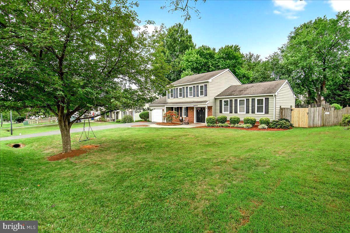 19808 Westerly Avenue Poolesville, MD 20837 - Photo 6 of 64 a front view of a house with a yard