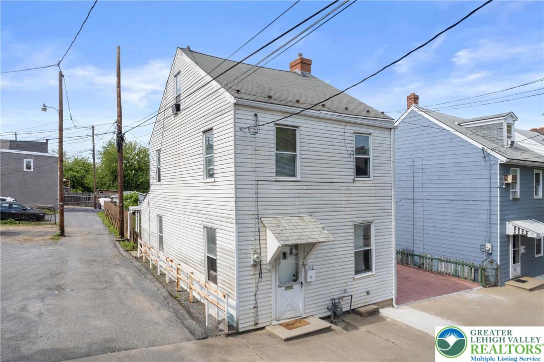 27 West Allen Street Allentown, PA 18102 - Photo 20 of 21 a front view of a house with garage