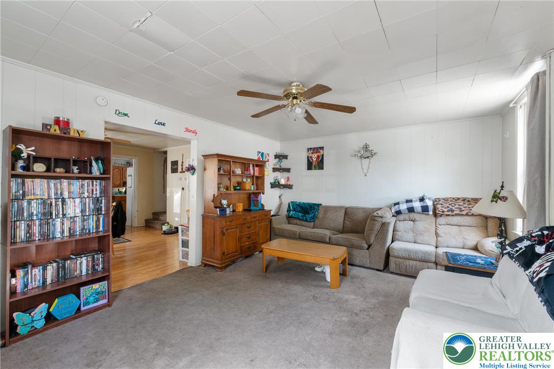 27 West Allen Street Allentown, PA 18102 - Photo 2 of 21 a living room with furniture a bookshelf and a window