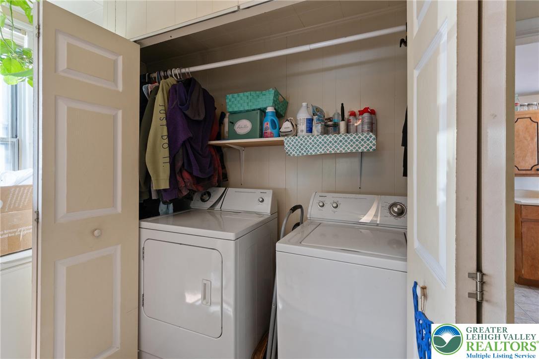 27 West Allen Street Allentown, PA 18102 - Photo 7 of 21 a view of storage and utility room with washer and dryer