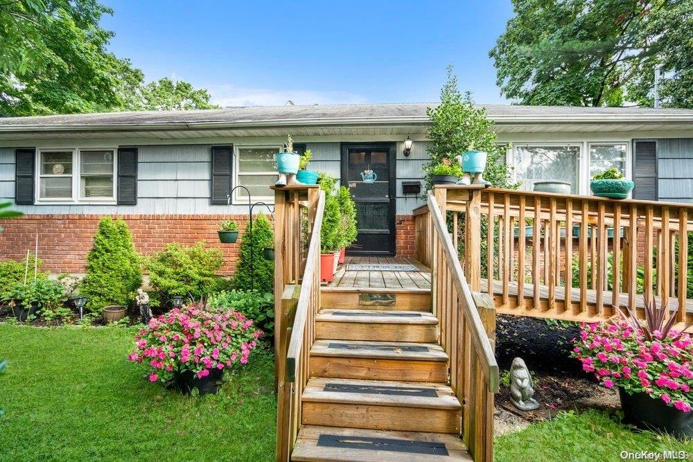 a front view of a house having garden