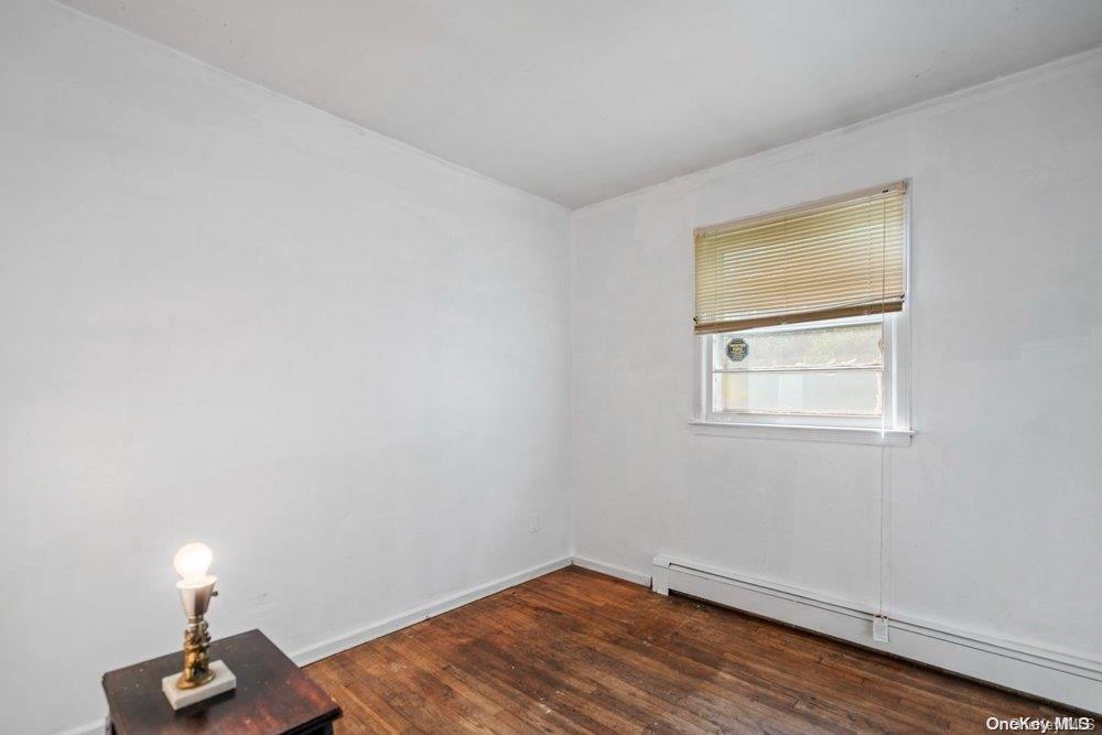 1931 Miller Place Merrick, NY 11566 - Photo 11 of 14 a view of empty room with wooden floor