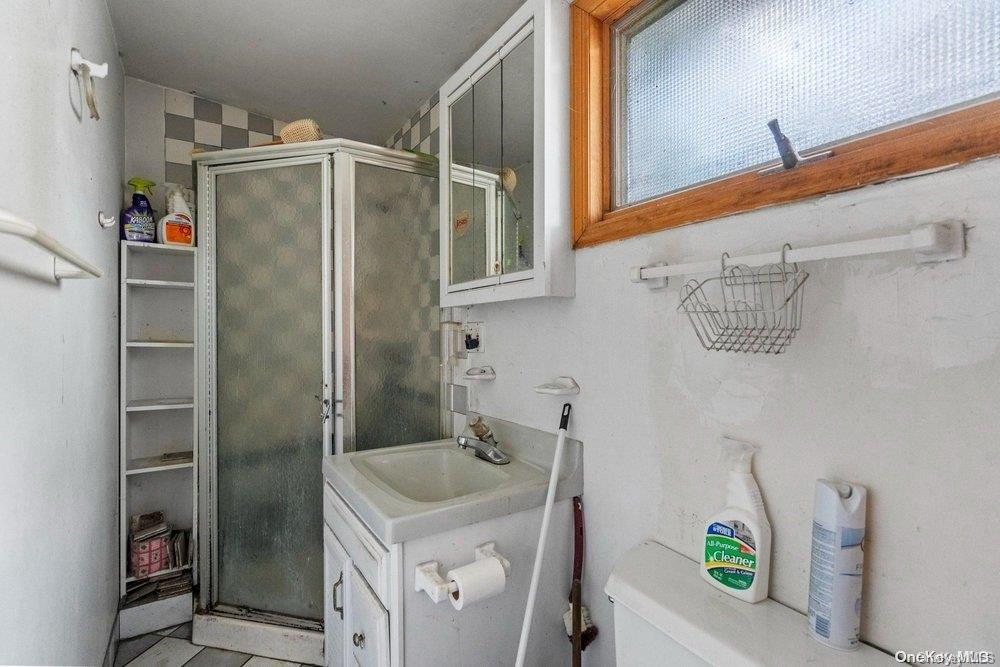 1931 Miller Place Merrick, NY 11566 - Photo 13 of 14 a bathroom with a shower and a sink