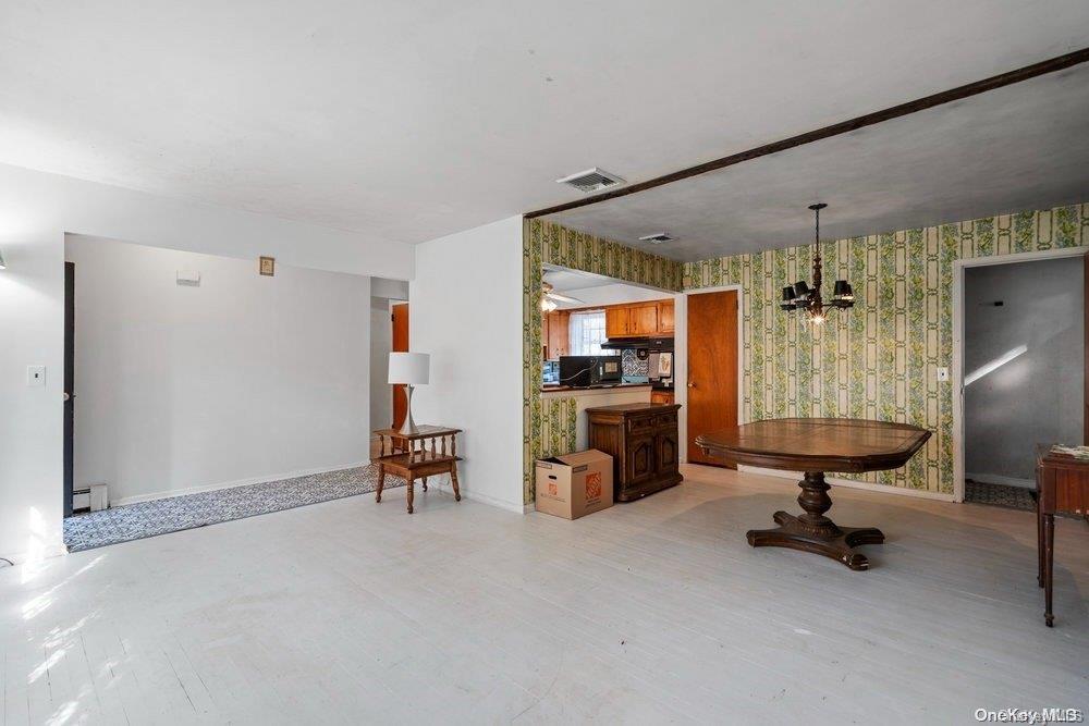 1931 Miller Place Merrick, NY 11566 - Photo 4 of 14 a view of a livingroom with workspace and a window