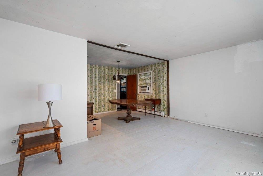 1931 Miller Place Merrick, NY 11566 - Photo 7 of 14 a view of a room with gym equipment and a window