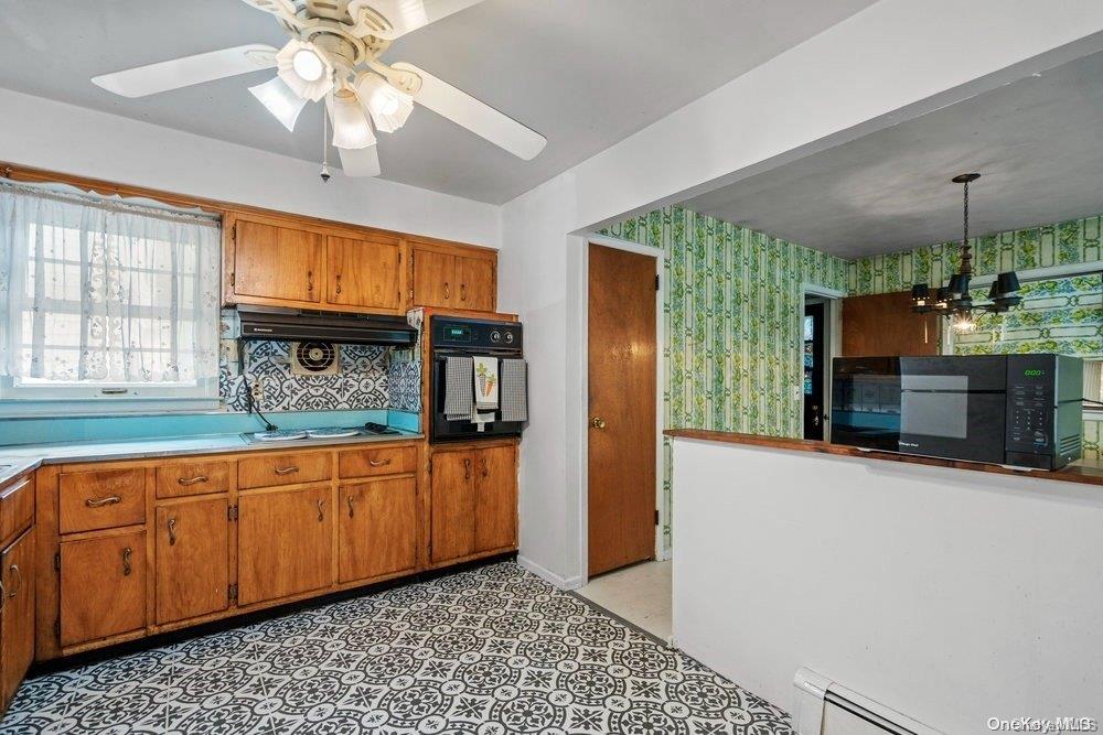 1931 Miller Place Merrick, NY 11566 - Photo 9 of 14 a kitchen with stainless steel appliances granite countertop a refrigerator a sink and dishwasher