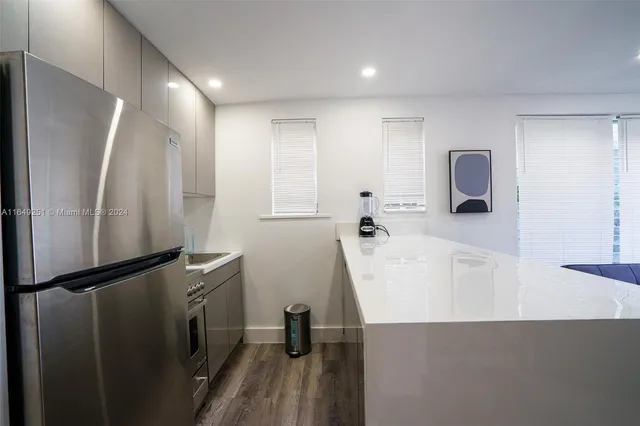 a living room with furniture and flowers