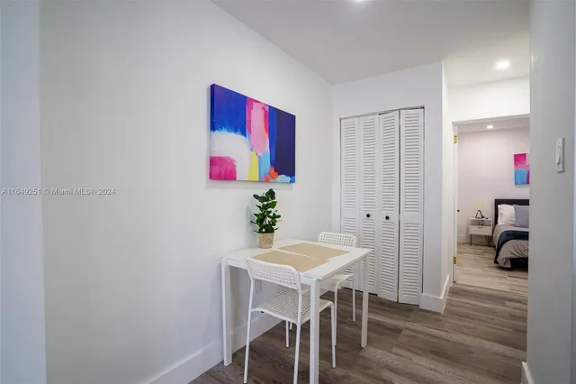 a bathroom with a sink a toilet and shower curtain