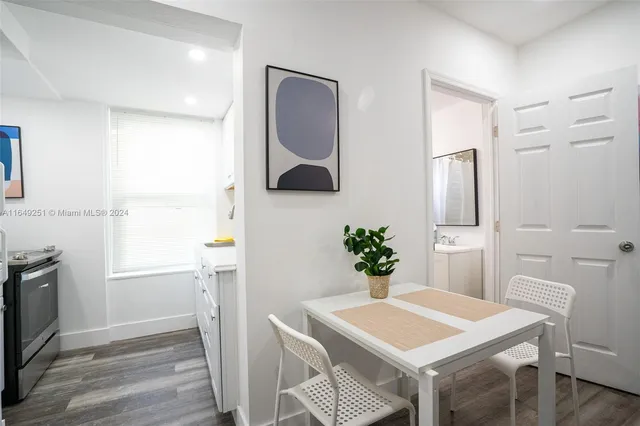 a kitchen with stainless steel appliances a stove a sink a microwave and cabinets