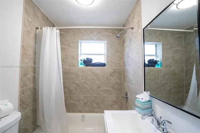 a bedroom with a bed and a table in it