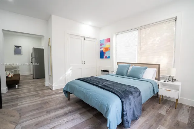 a kitchen with stainless steel appliances granite countertop a sink stove and white cabinets