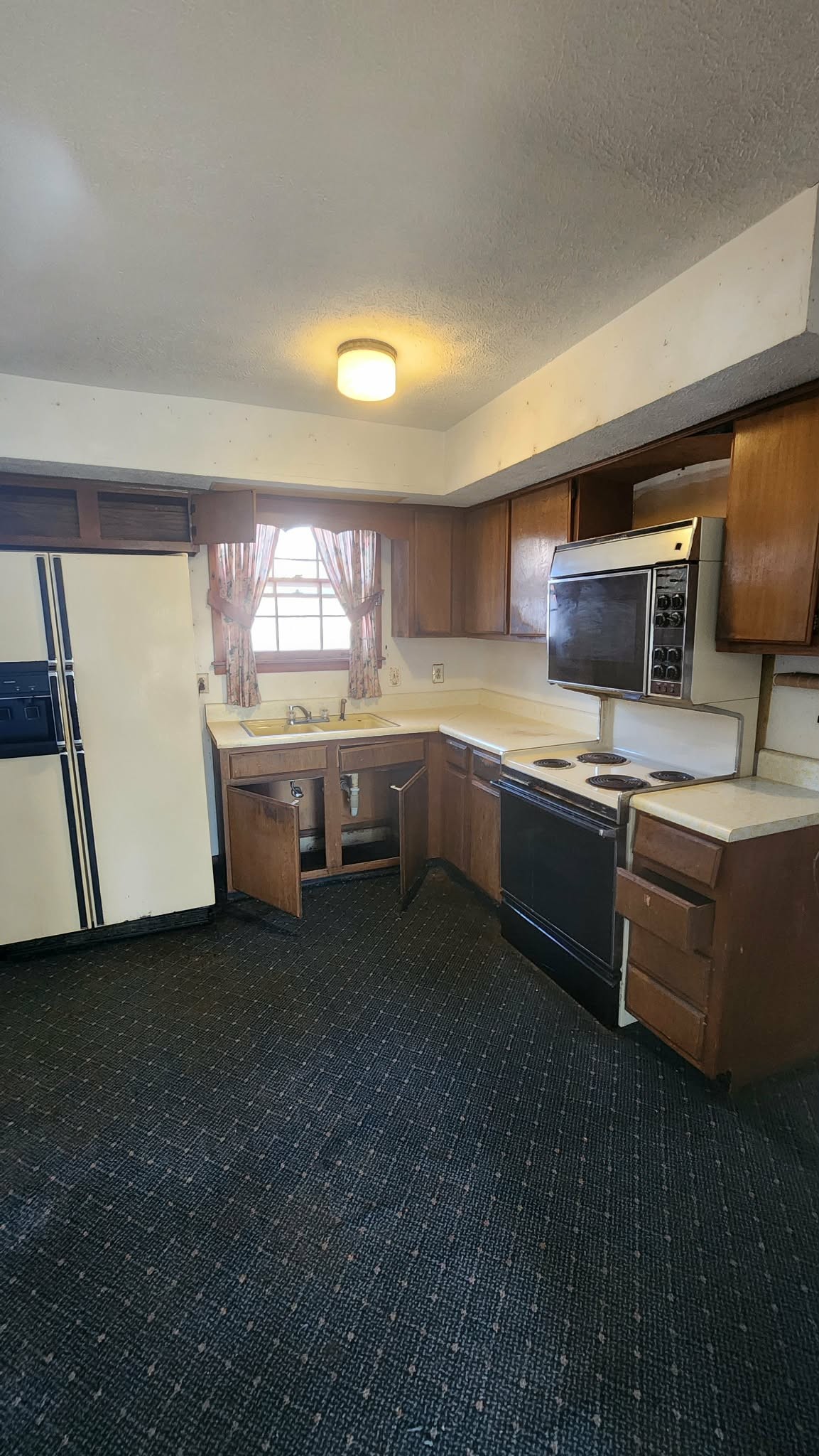 312 Bluebird Lane Dickson, TN 37055 - Photo 4 of 12 a kitchen with stainless steel appliances granite countertop a sink and a stove
