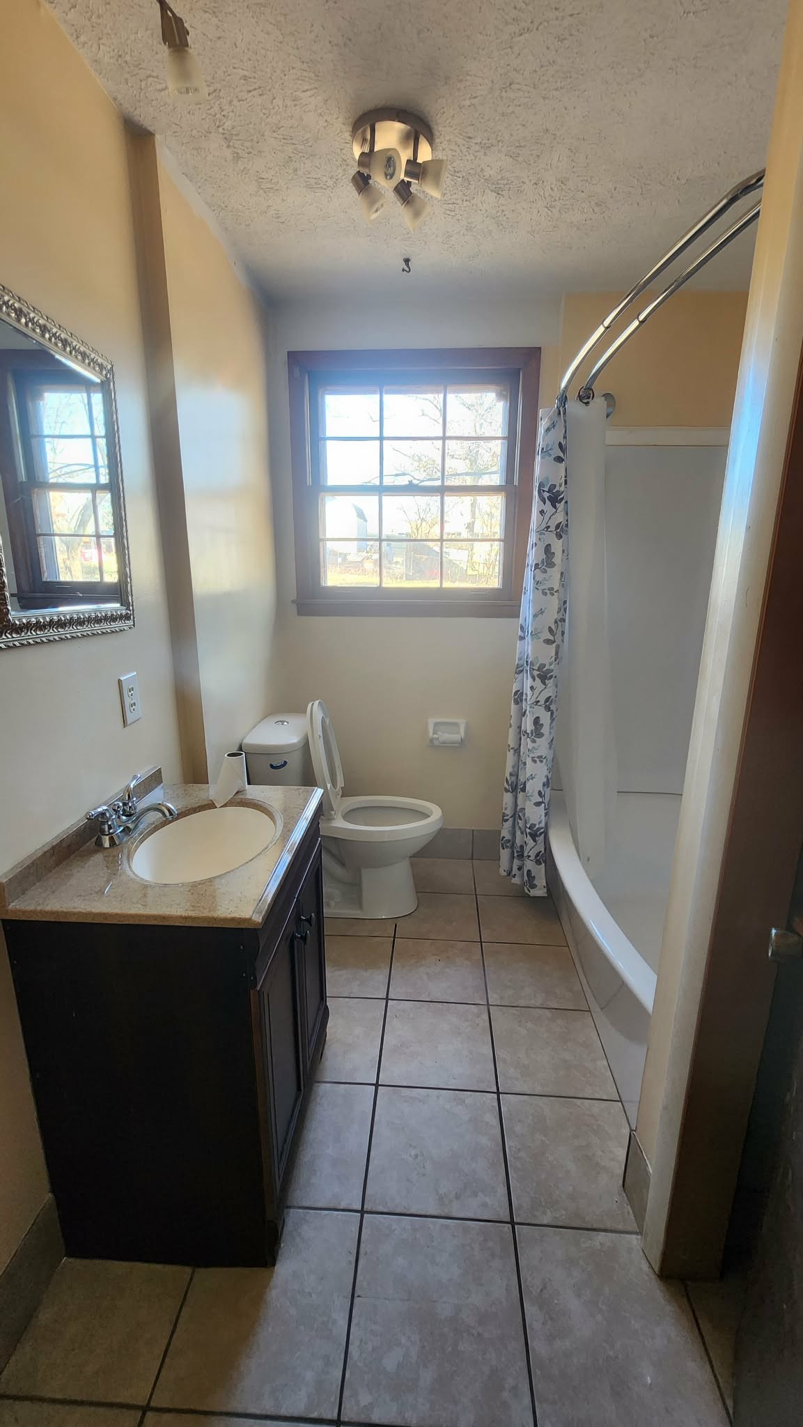 312 Bluebird Lane Dickson, TN 37055 - Photo 10 of 12 a bathroom with a sink a toilet and a mirror