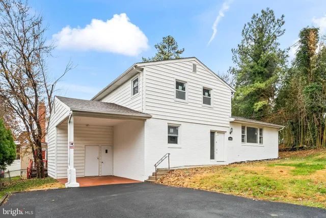 a front view of a house with a garage