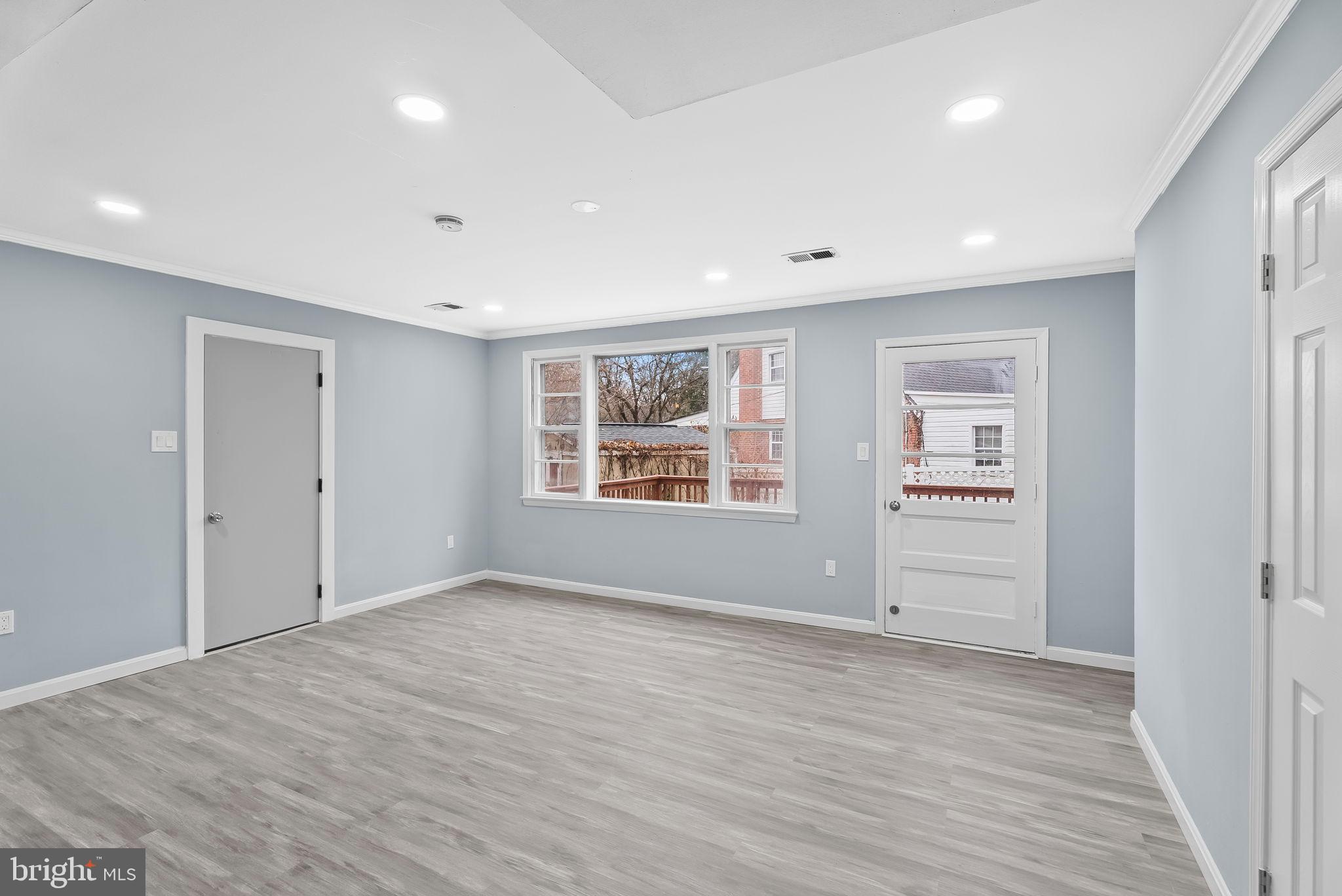 4302 Henderson Road Temple Hills, MD 20748 - Photo 13 of 33 wooden floor in an empty room with a window
