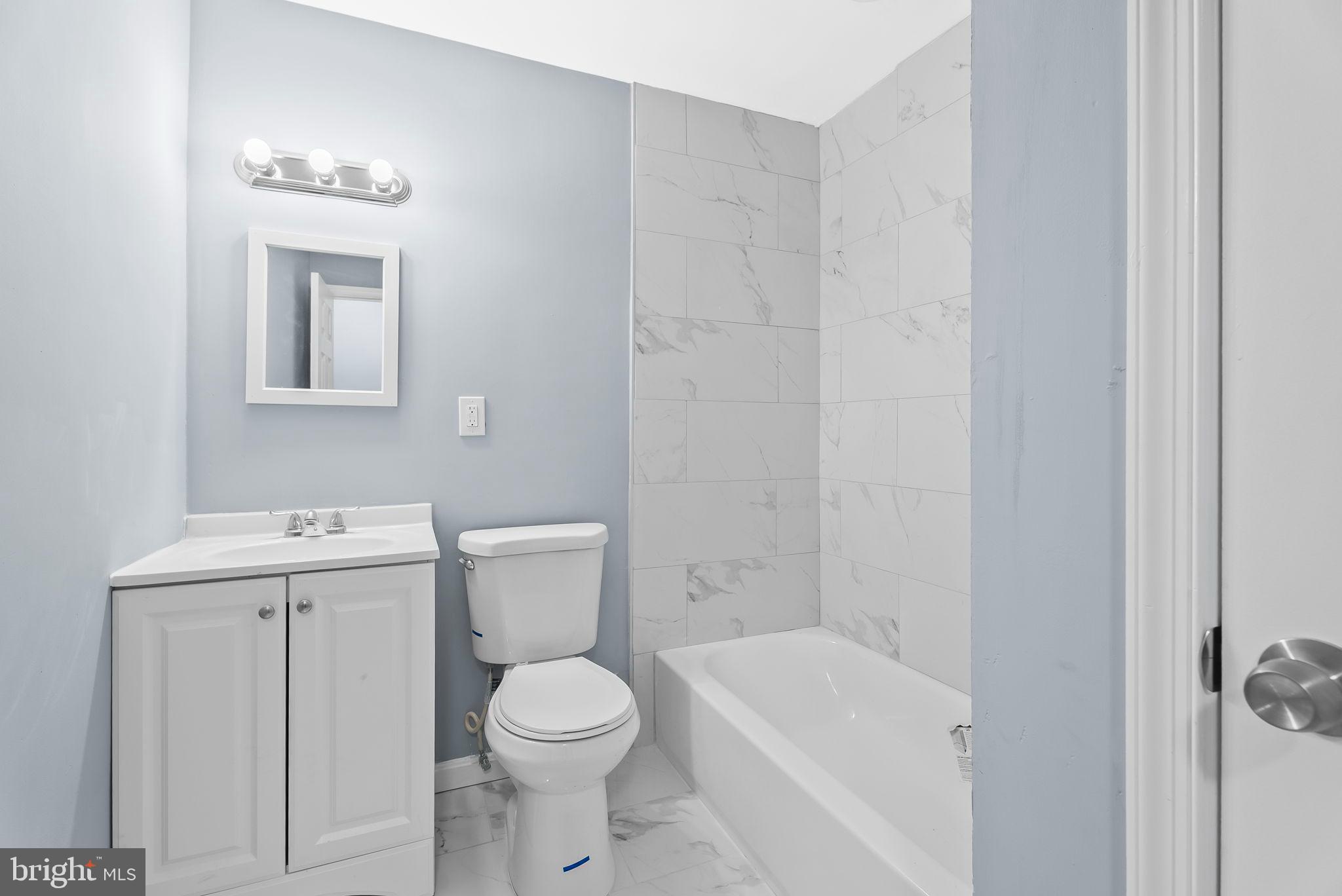 4302 Henderson Road Temple Hills, MD 20748 - Photo 22 of 33 a white toilet sitting next to a bathroom sink