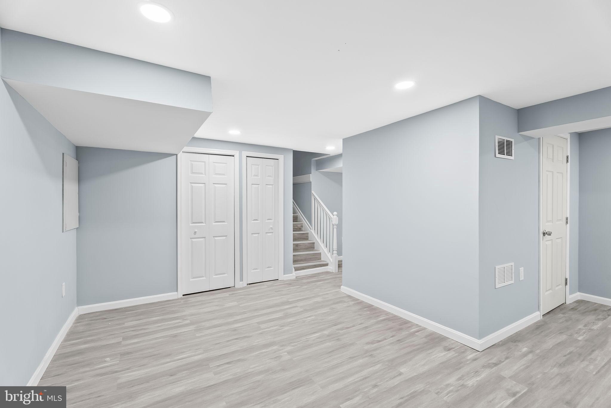 4302 Henderson Road Temple Hills, MD 20748 - Photo 25 of 33 a view of an empty room with wooden floor